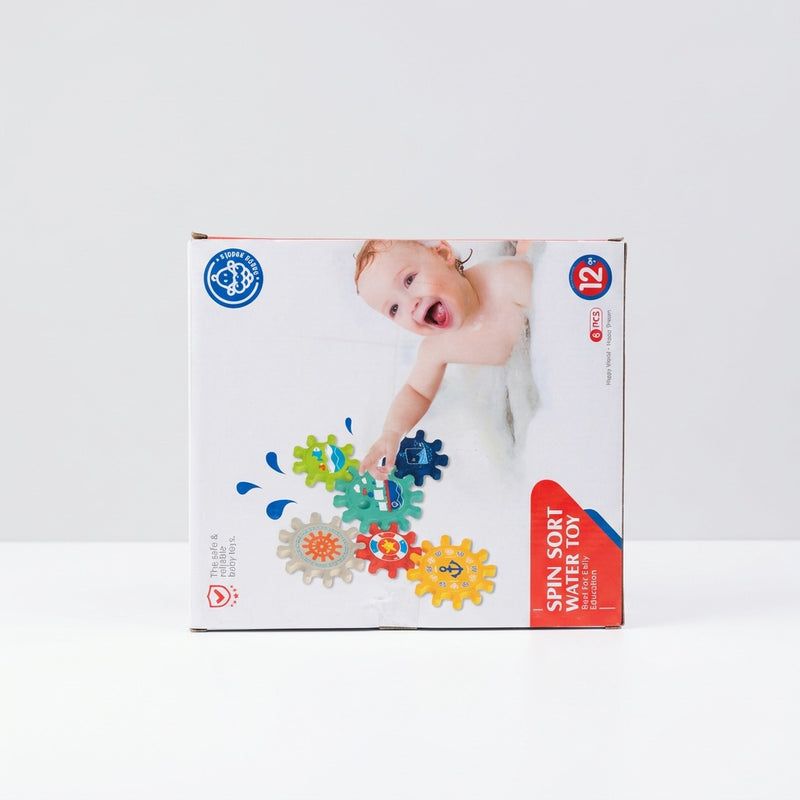 Box back showing a baby in the bath with the six gears stuck to the tiles