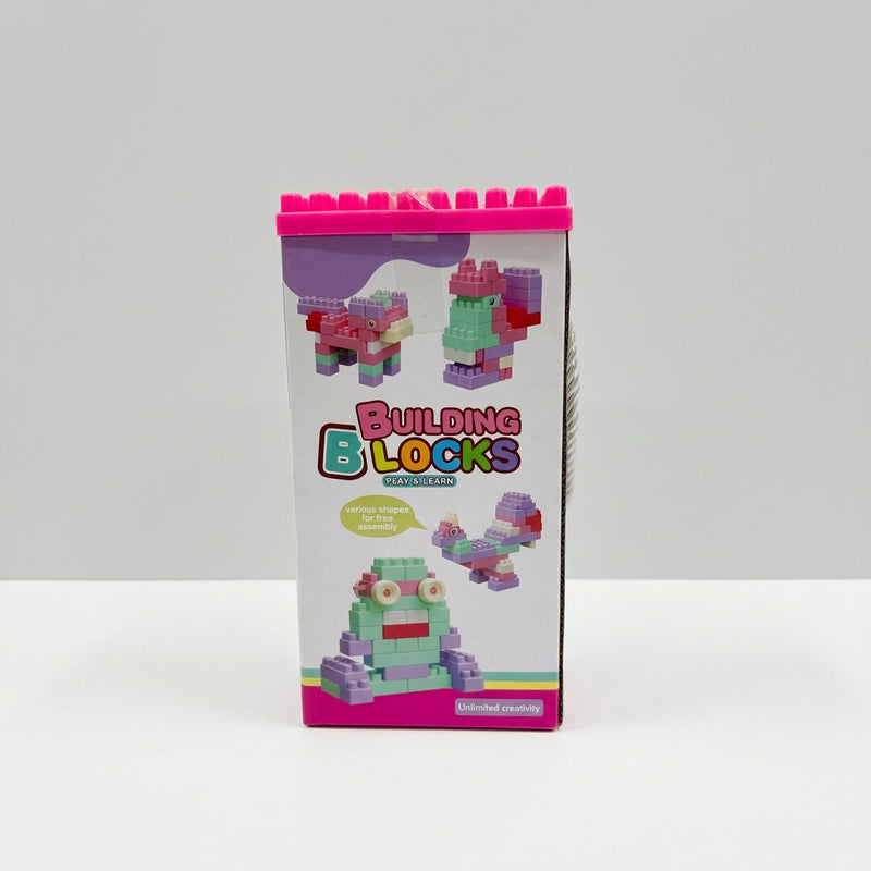 Side panel of the Building Blocks tower box, showing printed block builds of a bird and a robot