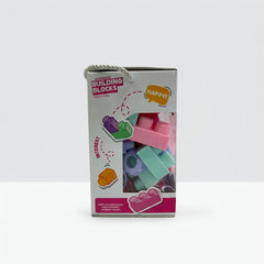 Side panel of the box with a speech-bubble graphic reading "Interest" next to green and pink block icons