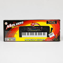 Melody Mixing box front showing the 37-key keyboard, the microphone and the TRY ME arrow