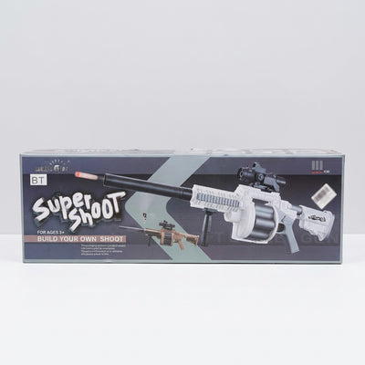Super Shoot soft dart gun on the box front, built up with scope and silencer