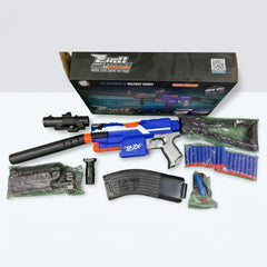 The gun unpacked beside its barrel, scope, foregrip, magazine and soft bullets