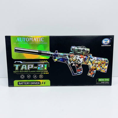 TAP-21 box front, Automatic and Battery Driven branding, graffiti-print rifle with scope