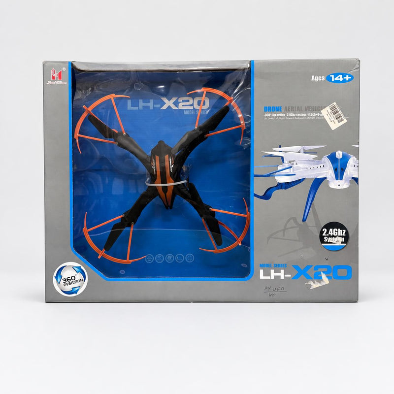 Radio Control Drone LH-X20 in its box, orange and black quadcopter with propeller guards