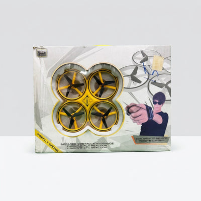 Firefly Drone box front, yellow quadcopter in the window with the hand controller pictured
