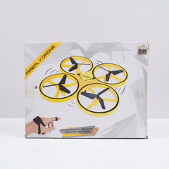 Box back showing the four-rotor drone in flight above the hand-worn controller