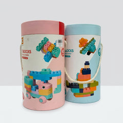Close-up of both tube lids showing the Soft Blocks logo and sample block builds printed on the cardboard