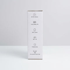 Box side panel printed with the feature icons - 4K HD camera, long battery life, APP control, 360 roll, folding body