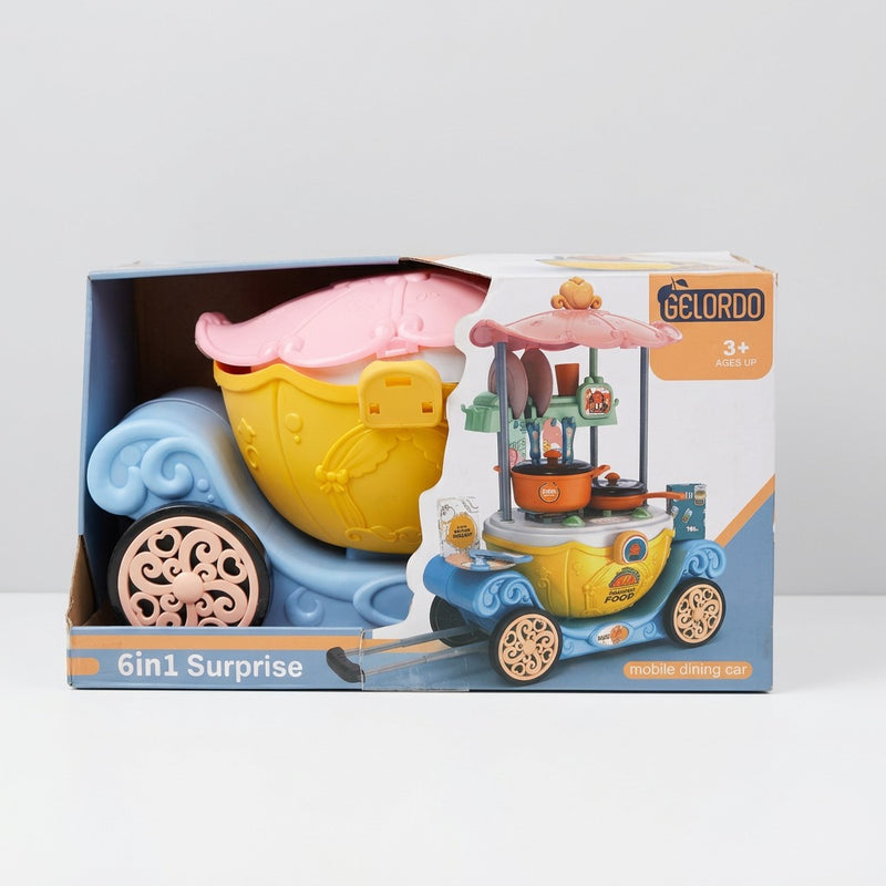 6in1 Surprise mobile dining cart box front, pink canopy over a fold-out stove top on a wheeled base