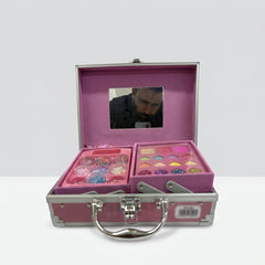 Open case showing the fold-out mirror above a tray of glitter pots