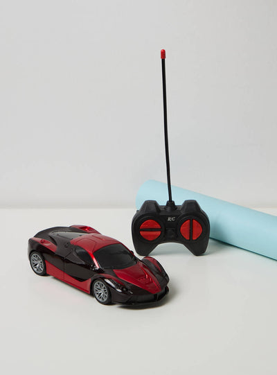 SpeedX RC Sports Car in black and red with its wired remote control