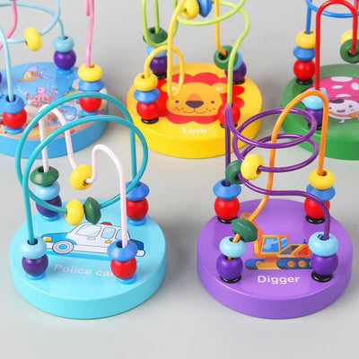 A row of bead mazes on lion, police car and digger bases