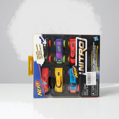 NERF Nitro six-pack card with six foam cars in the tray and the 5+ age line on the edge