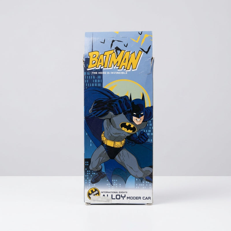 Box back panel with Batman punching forward against a yellow moon