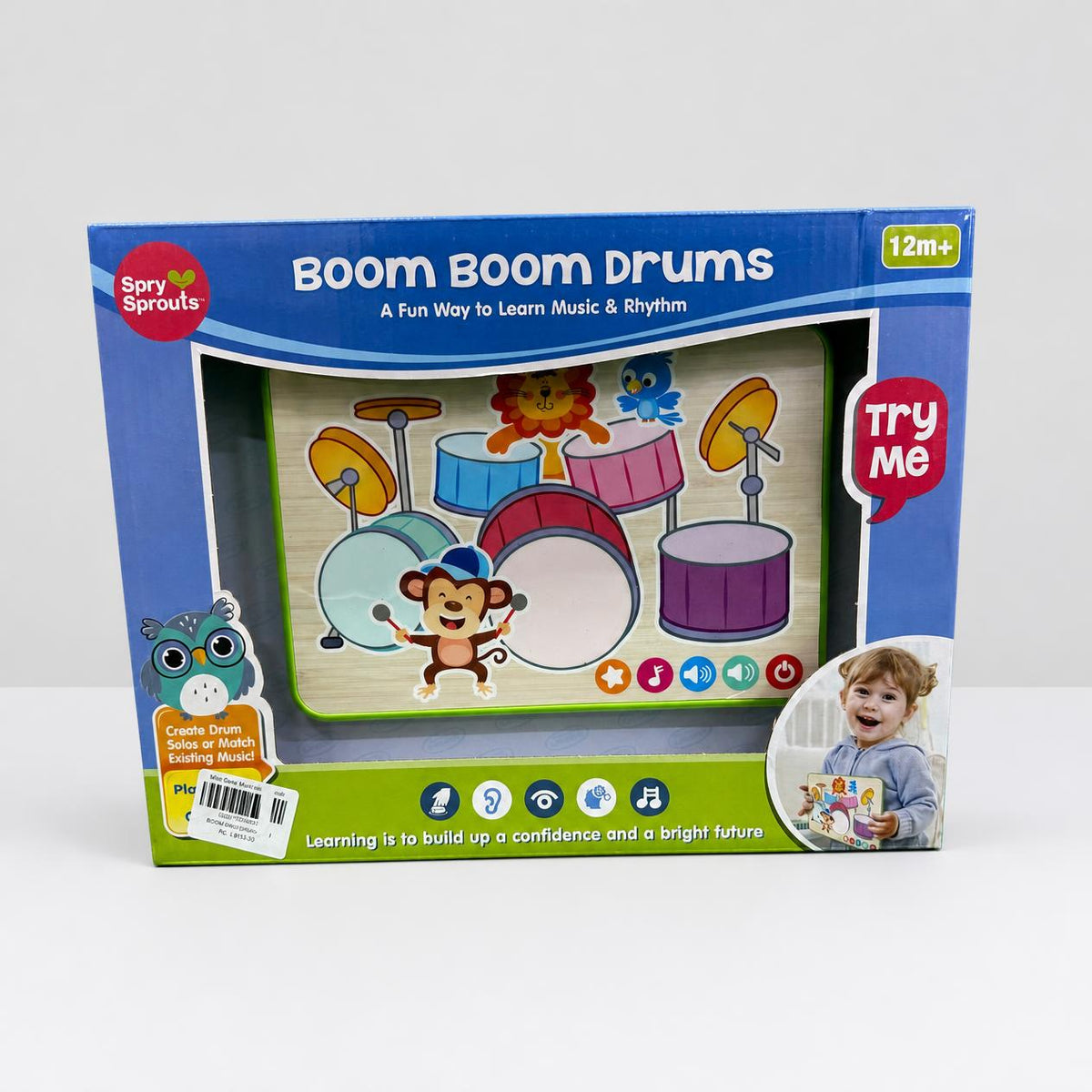 Boom Boom Drums pad in the box window, a printed drum kit with a monkey holding sticks