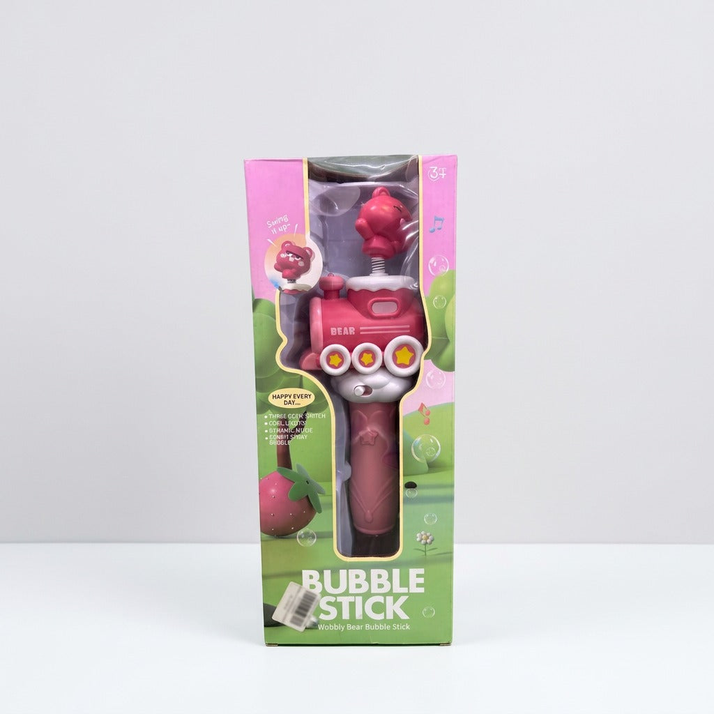 Bubble Stick box front, pink bubble wand with a bear head on a spring behind a window