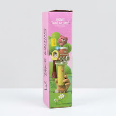 Box side panel showing a hand holding the stick while bubbles stream from the nozzles