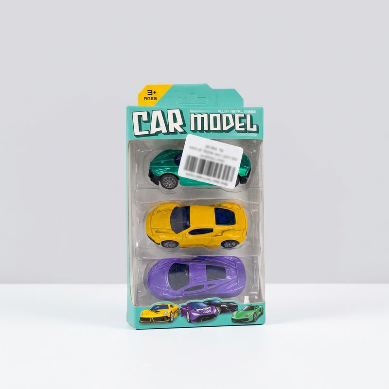 The pack held in a hand, showing the purple, yellow and green cars
