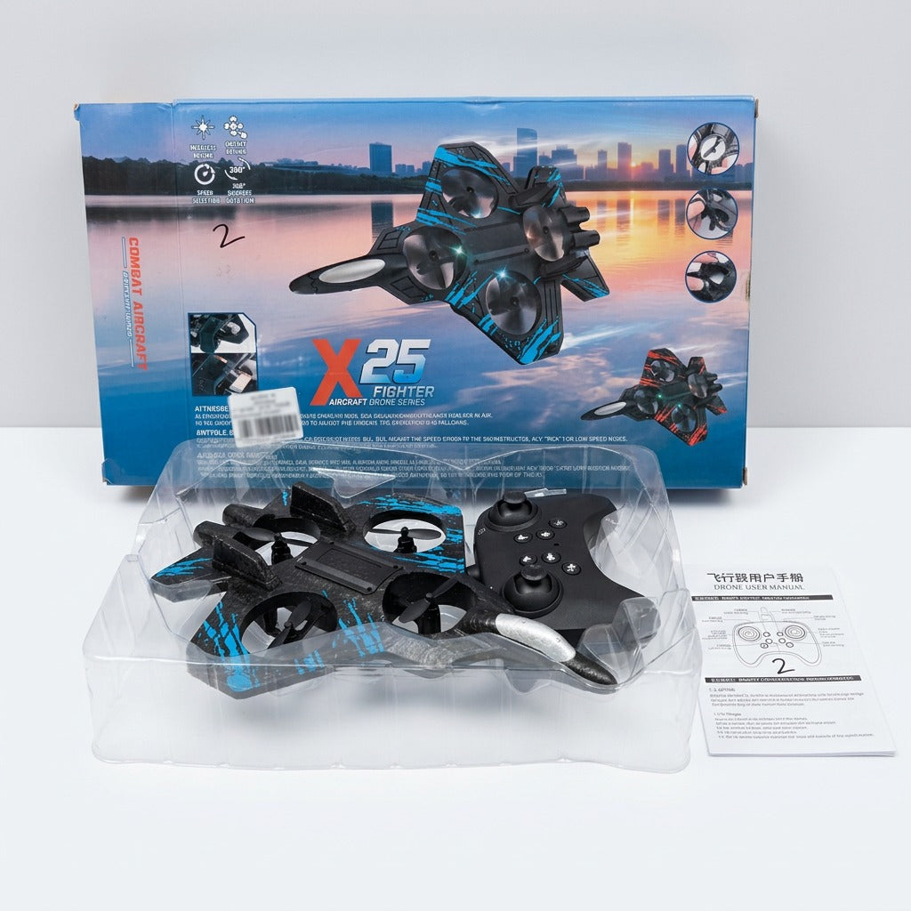 X25 Fighter drone and its gamepad controller in the tray in front of the box