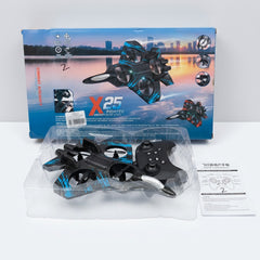 X25 Fighter drone and its gamepad controller in the tray in front of the box