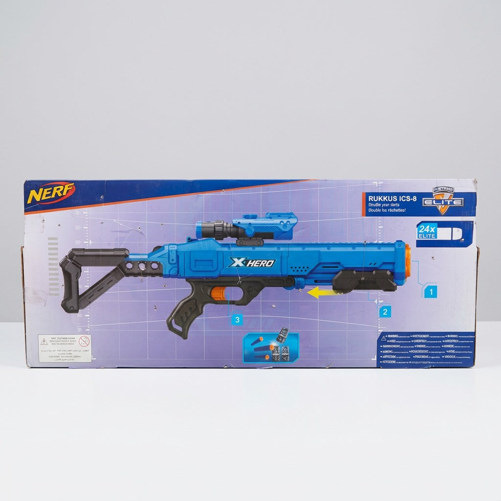 The packed blaster again, with foam darts and target cans in the tray