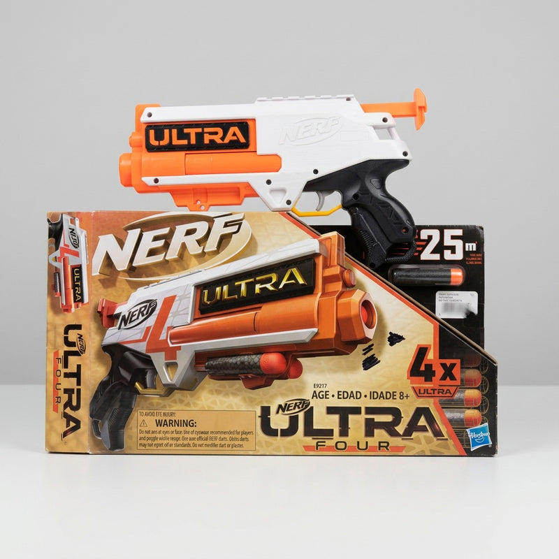 The white and orange Ultra Four blaster standing on its own