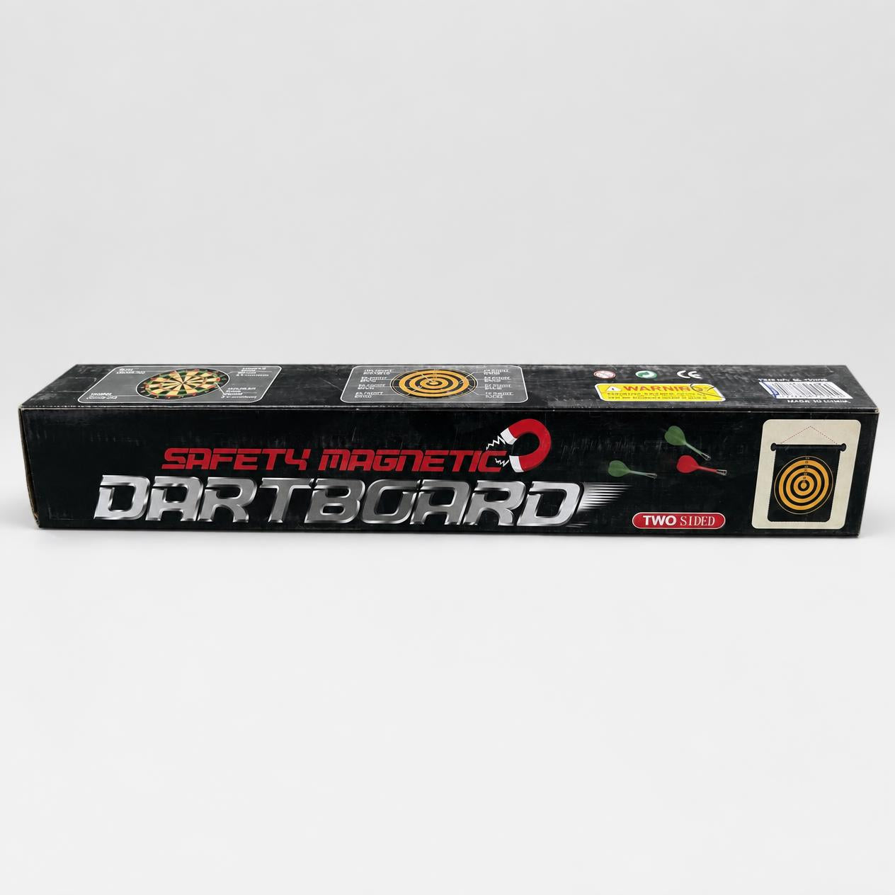 Safety Magnetic Dartboard box front, two-sided badge and a hanging board with darts