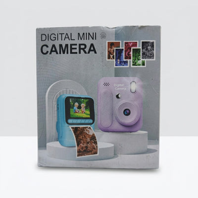 Box front showing two digital mini cameras, a blue camera with a screen and a printed photo strip, and a plain lavender camera, each on its own stand