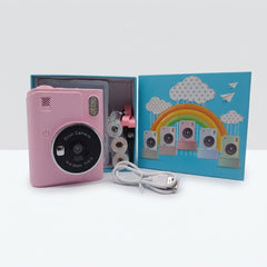 Pink print camera with its USB charging cable and small paper print rolls