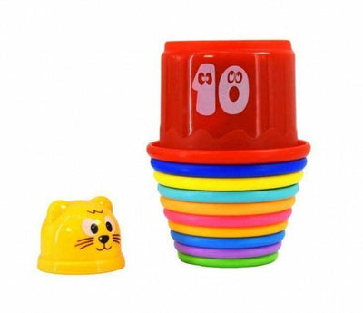 Ten stacking cups nested together in a nearly complete tower, with the smallest cat-face cup set beside it