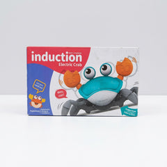 Electric crab toy box front, teal and white crab with orange pincer claws and an inductive-interaction badge