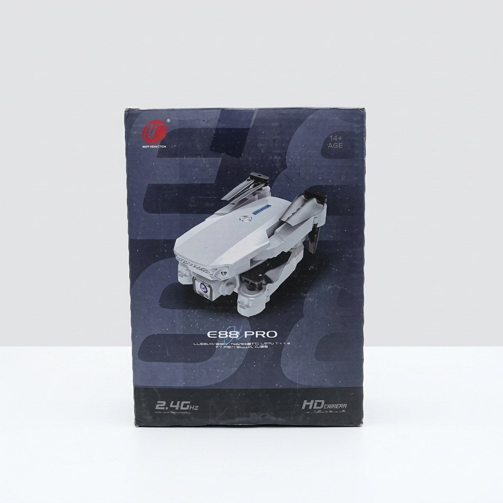 E88 Pro foldable drone box front, showing the quadcopter with its camera nose and fold-out arms, with the 14+ age badge and 2.4GHz radio text