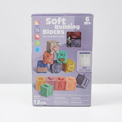 Soft Building Blocks box front, 6M+ badge, 12 PCS, animal and number block illustrations