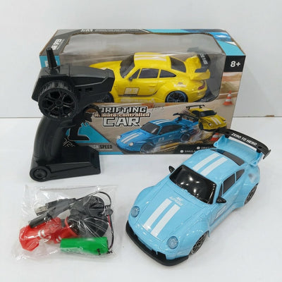 Sky blue drift RC car with white racing stripes and a rear wing, with its controller, spare wheel, traffic cone, battery pack and USB cable, beside the "8+" box
