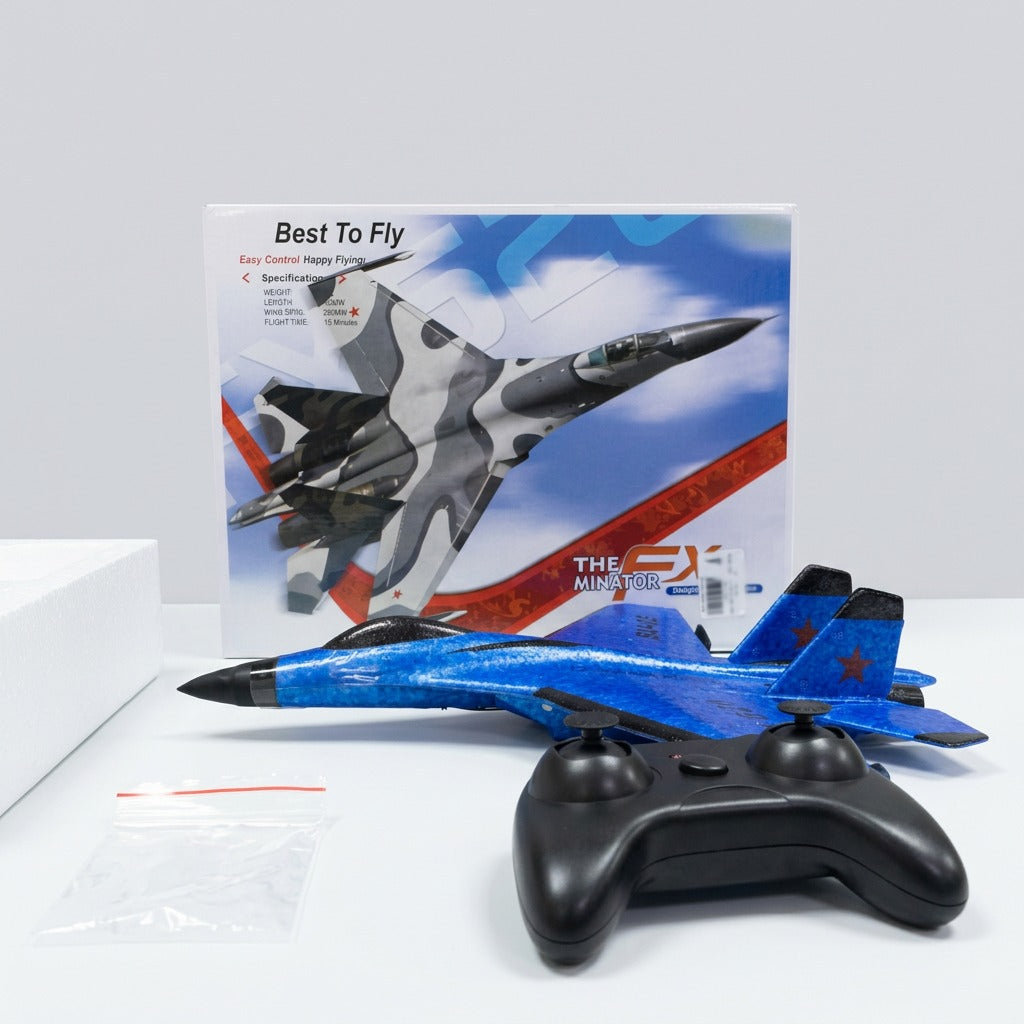 The assembled blue plane in front of the box with the controller and manual