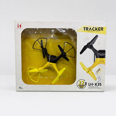 Tracker Camera Drone in its box, yellow and black quadcopter with guarded propellers