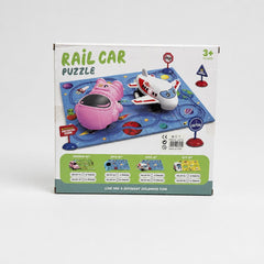 Rail Car Puzzle box front with the pink car, the airplane, the astronaut and the road signs on the track