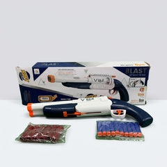 The gun out of the box beside a bag of red shells and a bag of blue foam darts