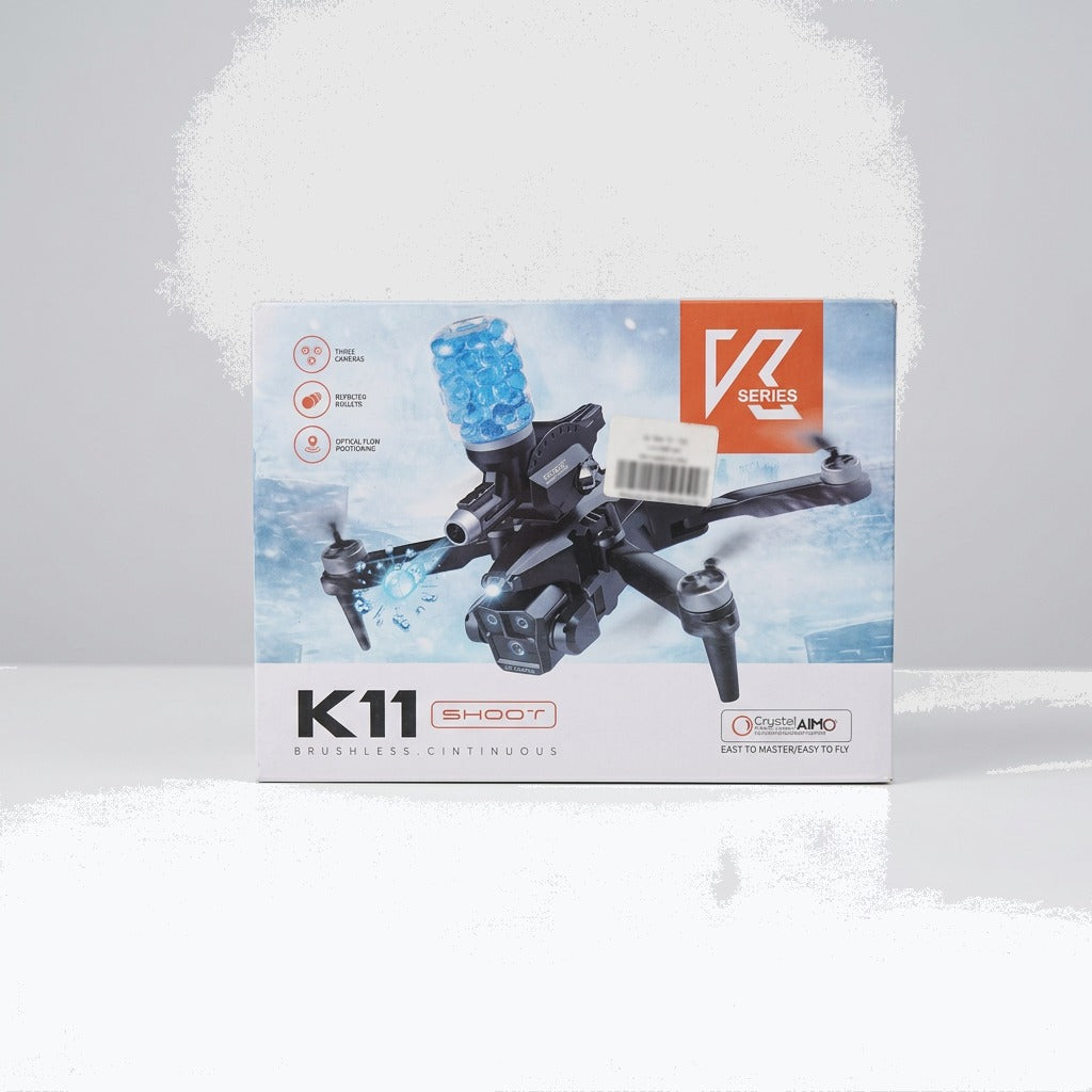 K11 Shoot drone box front, black quadcopter with the gel-bead blaster magazine on top