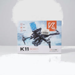 K11 Shoot drone box front, black quadcopter with the gel-bead blaster magazine on top
