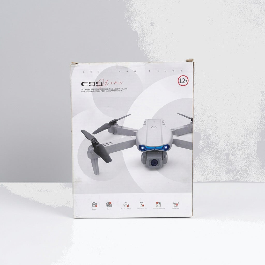 Close-up of the shop price sticker reading Drone With Cmera (U1) Rs. 10,875.00, next to the red remote control