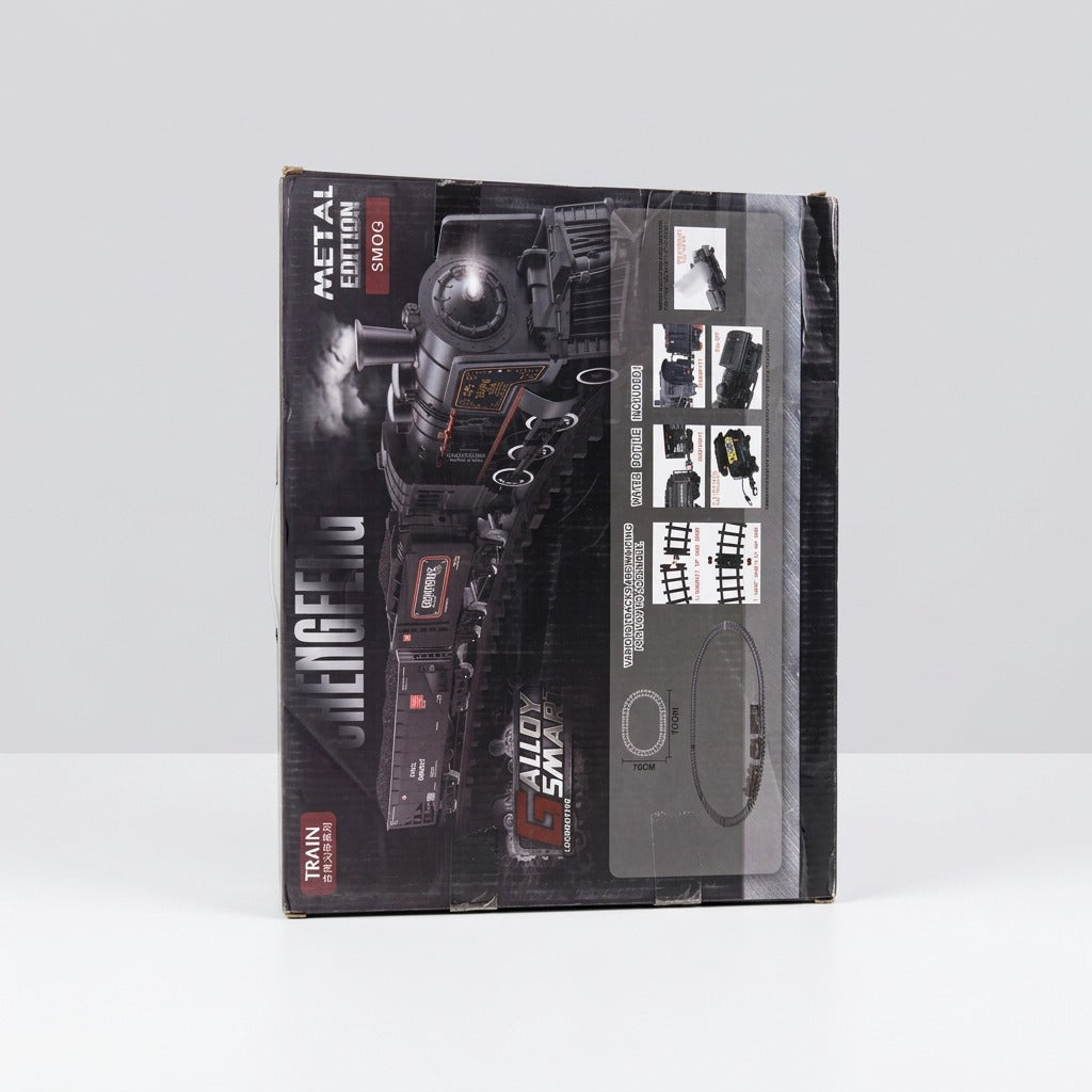 Close-up of the box front showing the locomotive's wheels and boiler detail, the feature icon row and the shop price sticker