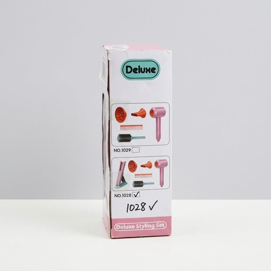 Reverse of the box with the shop price sticker and a child using the hairdryer