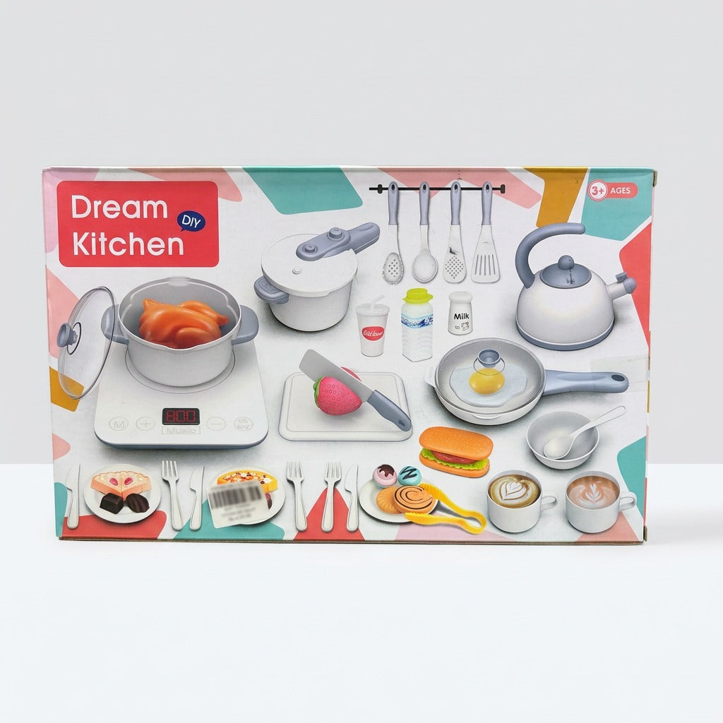 Dream Kitchen DIY cookware box front, with a pressure cooker, kettle, frying pan and play food