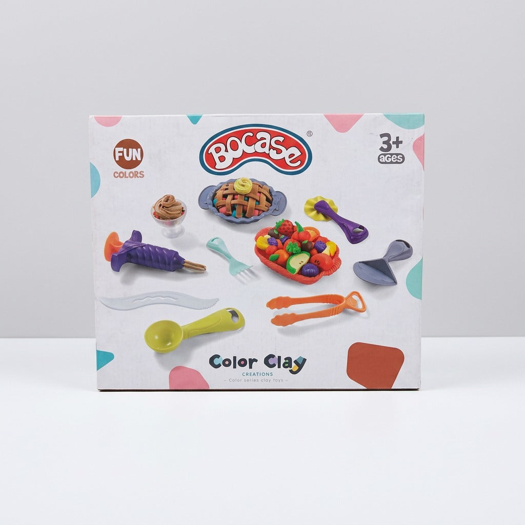 Bocase Color Clay box front, with a woven pie mould, a fruit tray and dough-shaping tools