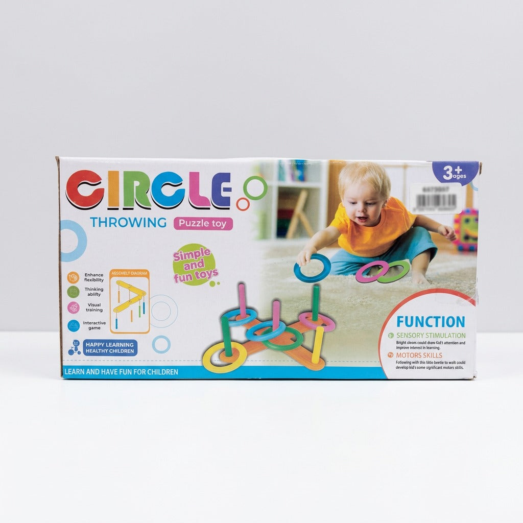 Ring Toss Puzzle Toy box front, a toddler throwing rings onto the assembled beetle-shaped base, 3+ age badge
