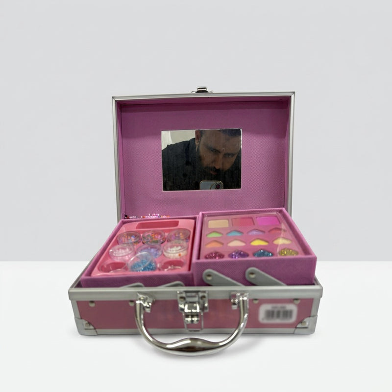 Open case showing the fold-out mirror above a tray of glitter pots